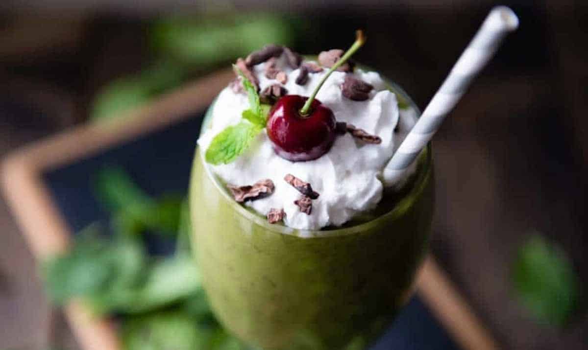 Vegan shamrock shake in a stemmed glass.