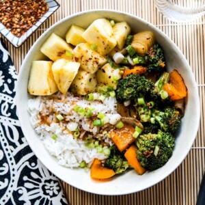 Bowl of Teriyaki vegetables over rice.