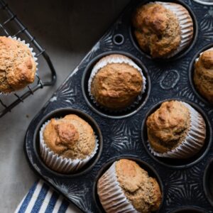 Gluten-free banana muffins in a muffin pan.