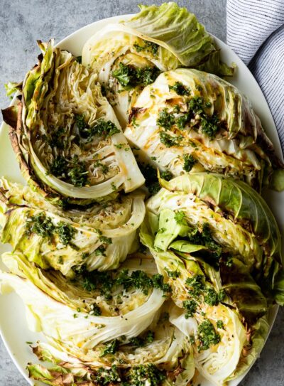 Oblong plate of roasted cabbage wedges.