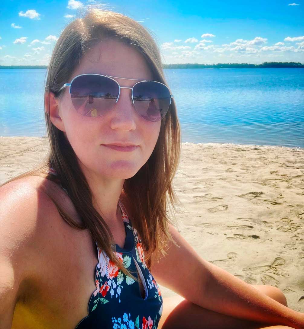 Kimber Furman at the beach working on relaxing.