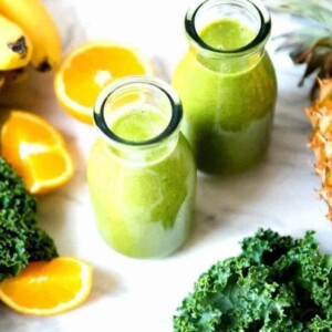 Two glass carafes of coconut water smoothies.