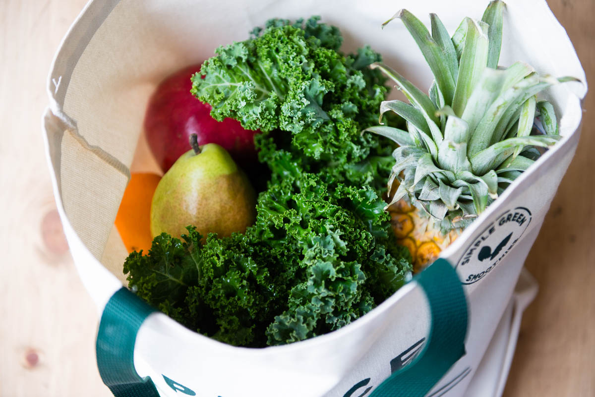 Cloth grocery bag of fruits and vegetables.