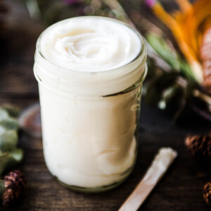White homemade deodorant in a glass jar.