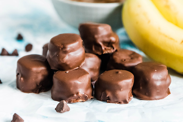 Pile of chocolate covered banana bites.