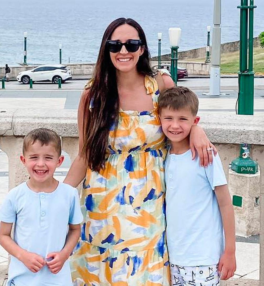 Laura Gooden with kids along waterfront.