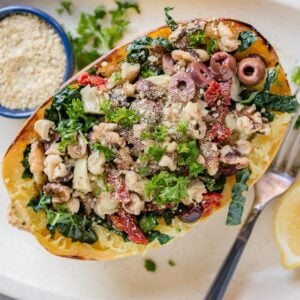 Roasted spaghetti squash filled with toppings.