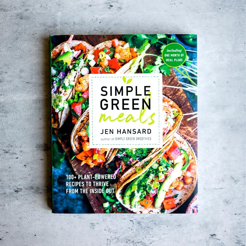 Simple green meals cookbook on concrete table.