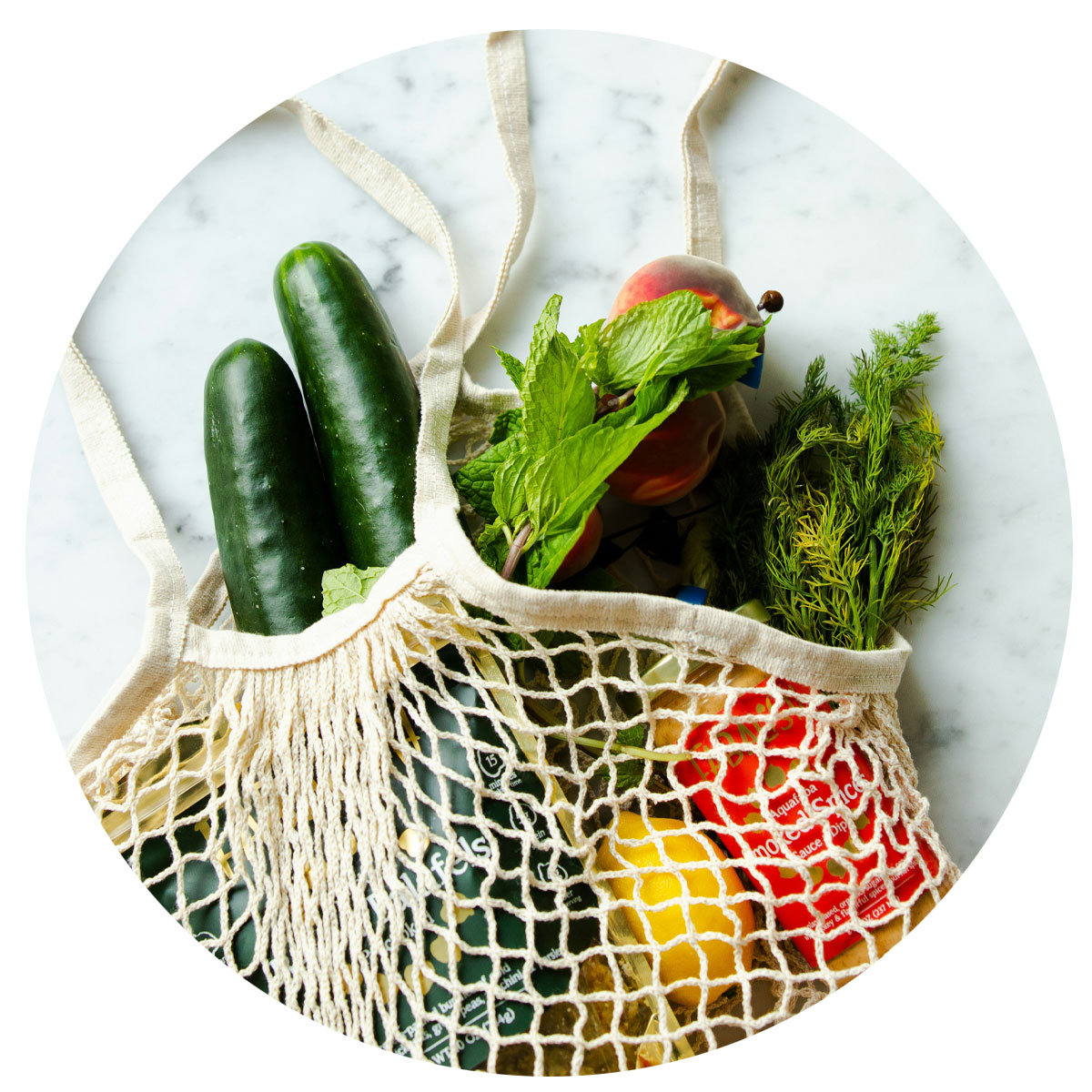 Cloth mesh bag filled with vegetables.
