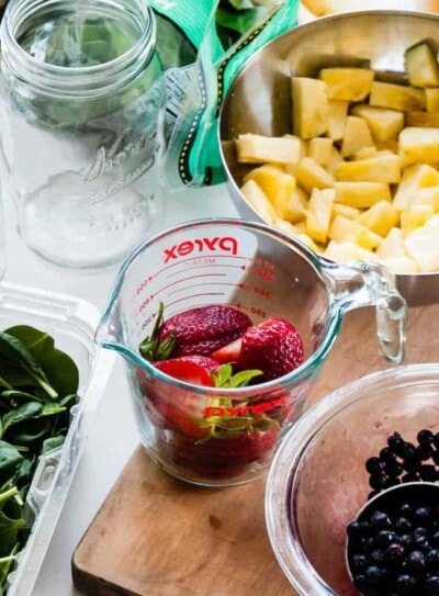 Bowls and measuring cups of fruits and vegetables.
