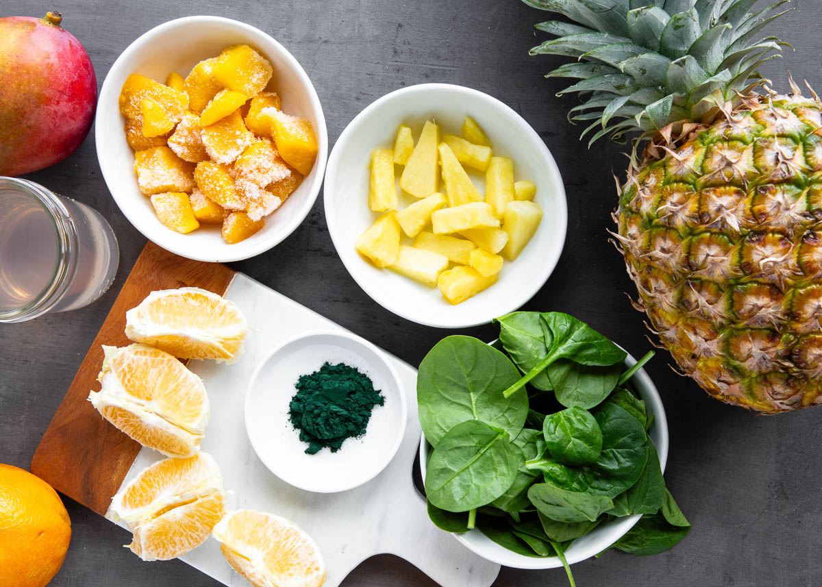 Ingredients for spirulina smoothie laid out on a table.