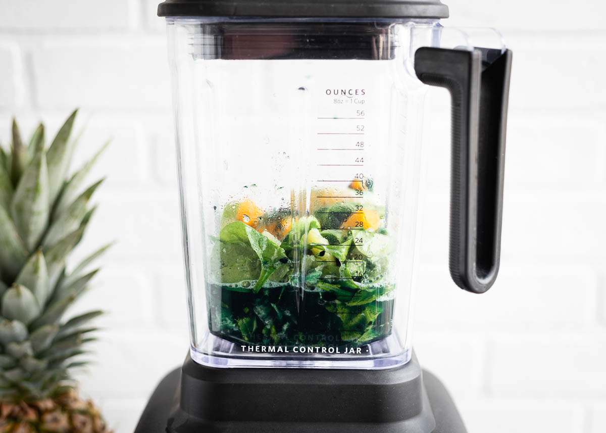 Spirulina smoothie ingredients in a blender.
