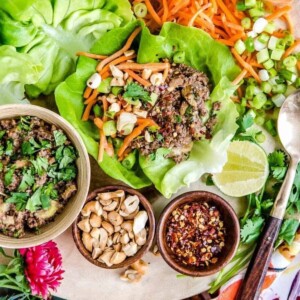 Thai lettuce wraps with small bowls of fillings.