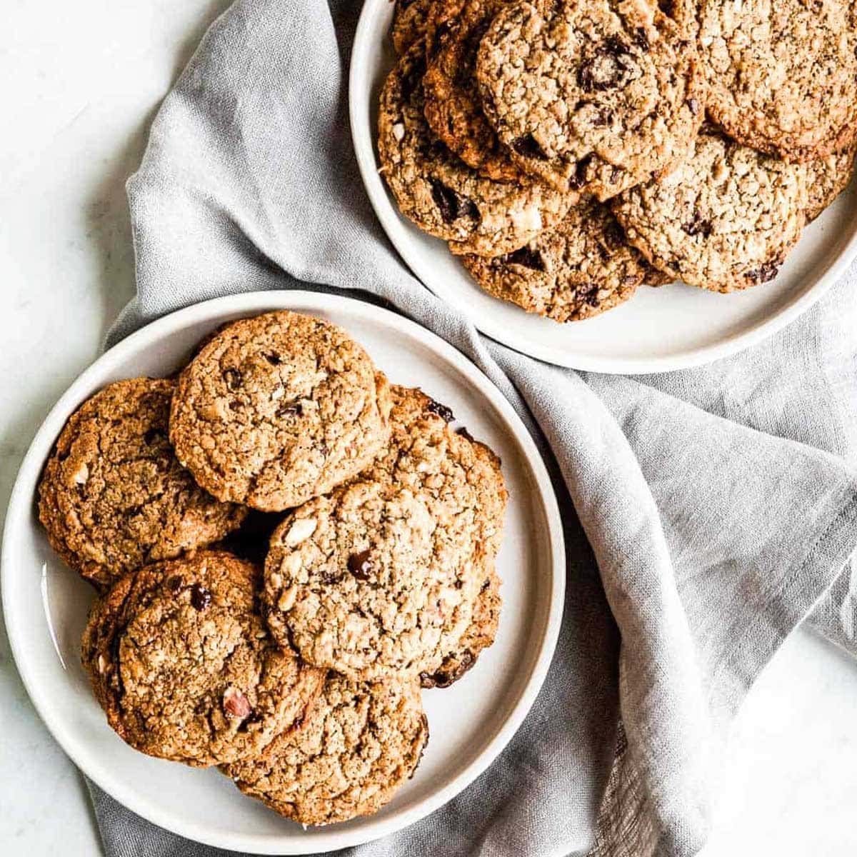 2 plates full of vegan chocolate chip cookies.