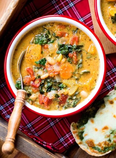 Vibrant, loaded vegan minestrone soup in a bowl.