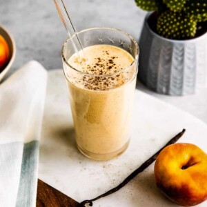Tall glass of vanilla bean yogurt smoothie.